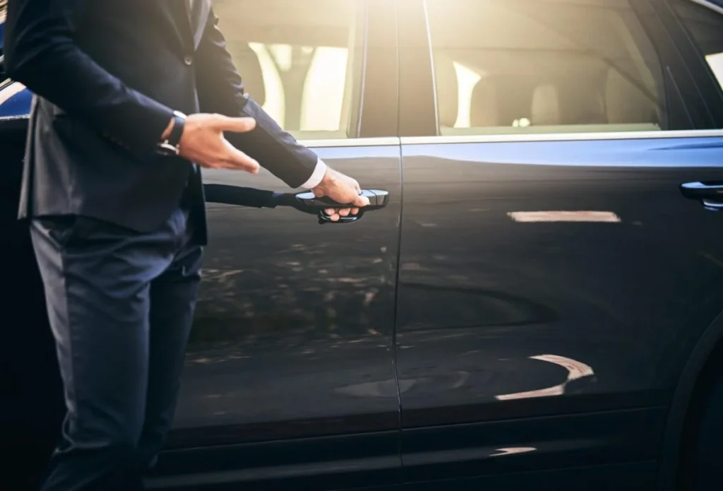your-ride-has-arrived-cropped-shot-well-dressed-unrecognizable-man-opening-car-door-Pearl